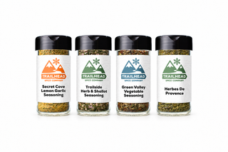 Garden Treasure Gift Set with Secret Cove Lemon Garlic Seasoning, Trailside Herb & Shallot Seasoning, Green Valley Vegetable Seasoning, Herbes de Provence (Salt-Free) jars side by side