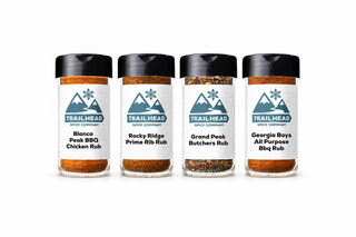 Grill Master Gift Set with Blanca Peak BBQ Chicken Rub, Rocky Ridge Prime Rib Rub, Grand Peak Butchers Rub, Georgia Boys All-Purpose BBQ Rub jars side by side