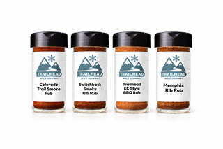 Pit Master Gift Set with Colorado Trail Smoke Rub, Switchback Smoky Rib Rub, Trailhead KC-Style BBQ Rub, Memphis Rib Rub jars side by side