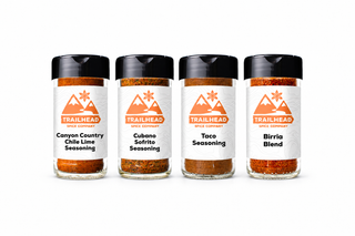 South of the Border Gift Set with Canyon Country Chile Lime Seasoning, Cubano Sofrito Seasoning, Taco Seasoning, Birria Blend jars side by side